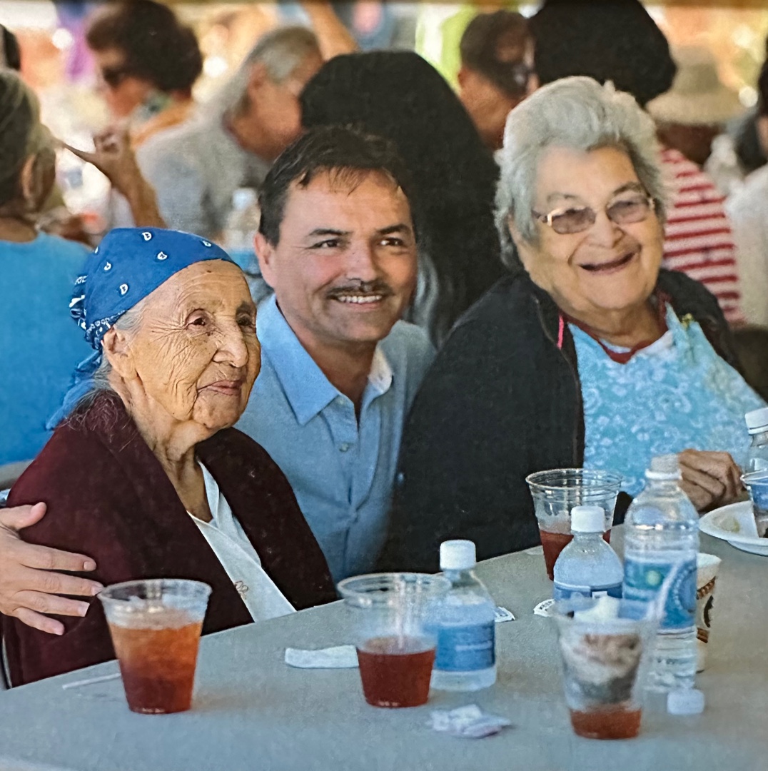 Chief Lambert with Amanda Swimmer at a community gathering