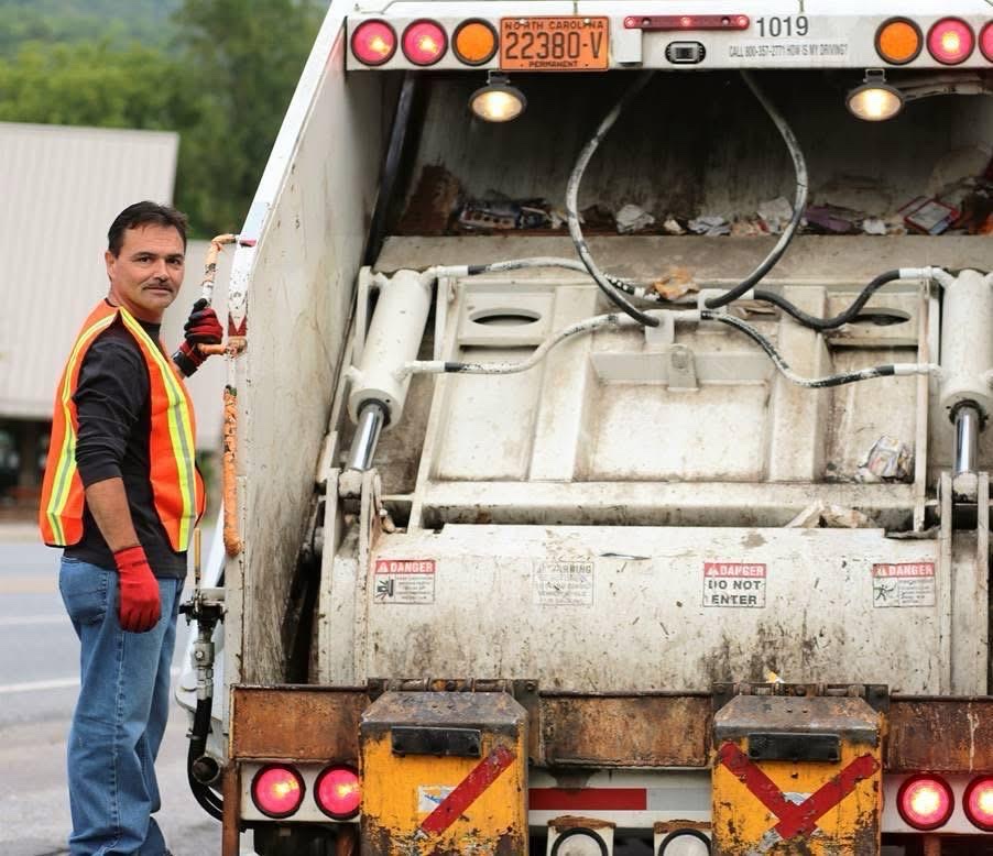 Chief Lambert riding with the tribal garbage crew