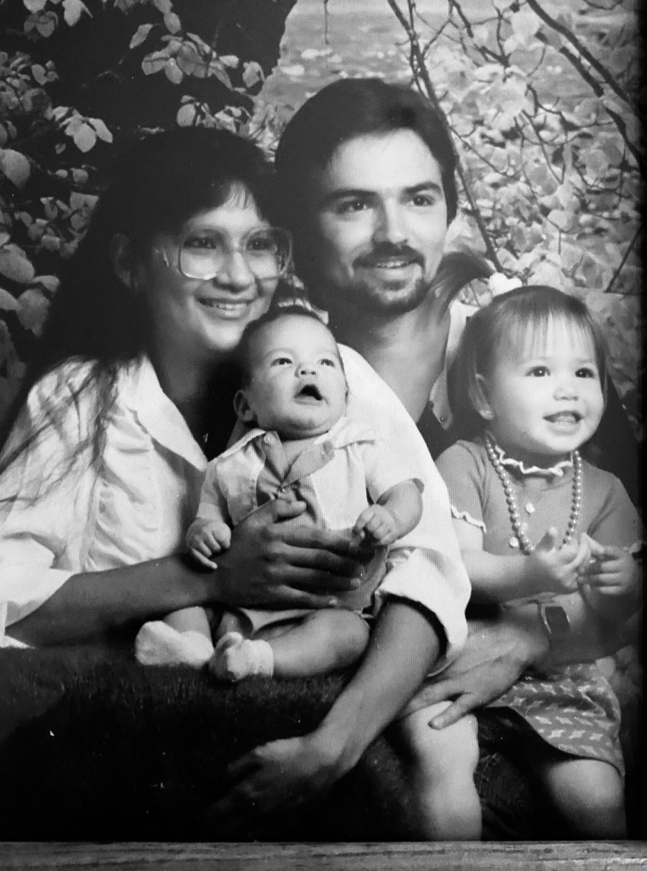 The Lambert family, black and white portrait, 1988 — Cyndi, Patrick, baby Nelson, and toddler Gina