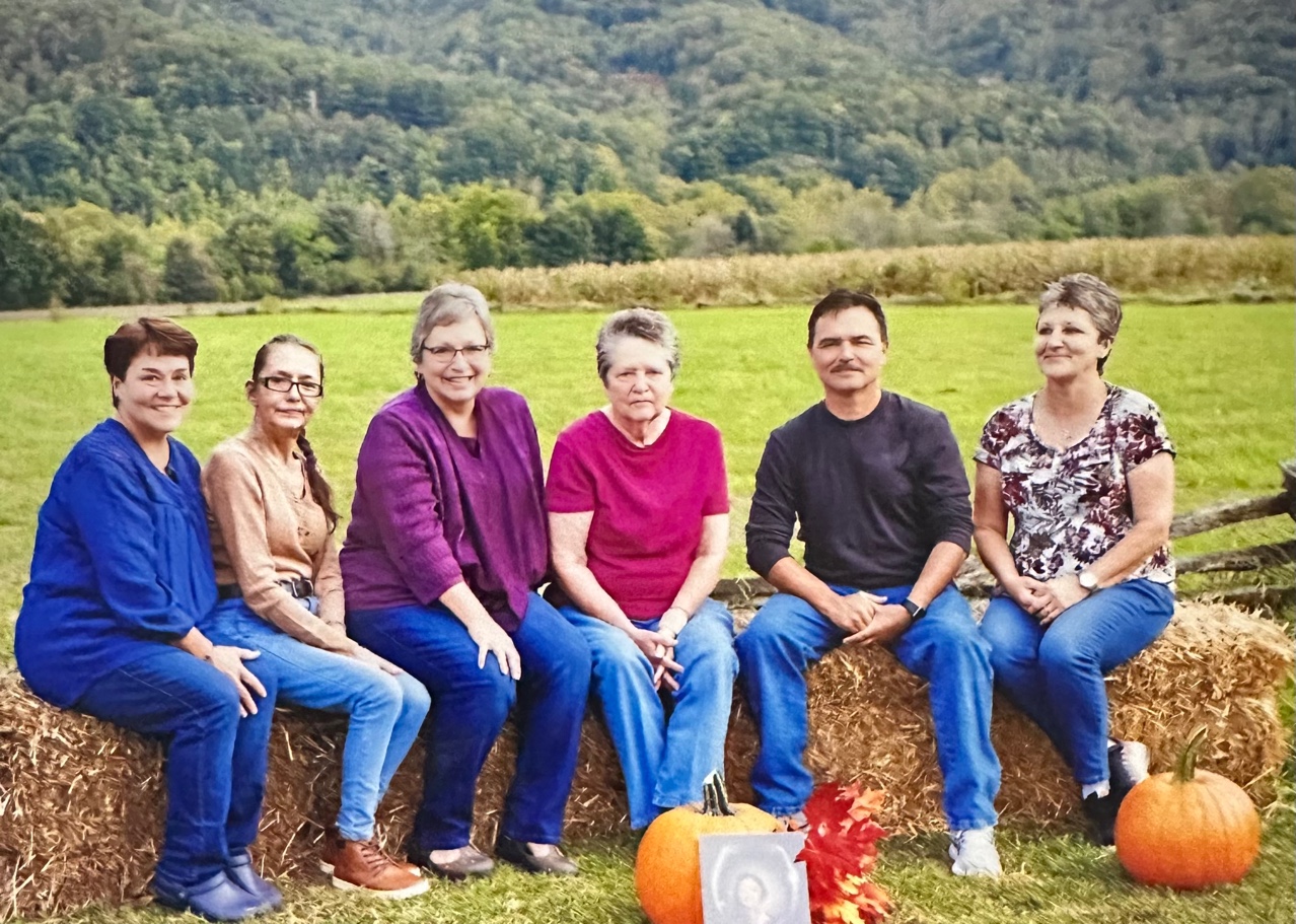 Patrick Lambert with his sisters on the Qualla Boundary