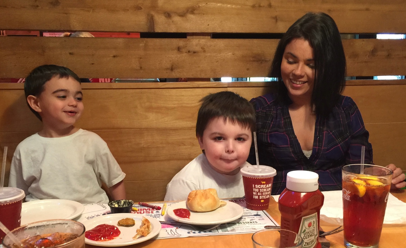 Tiffany with John and Bear at dinner