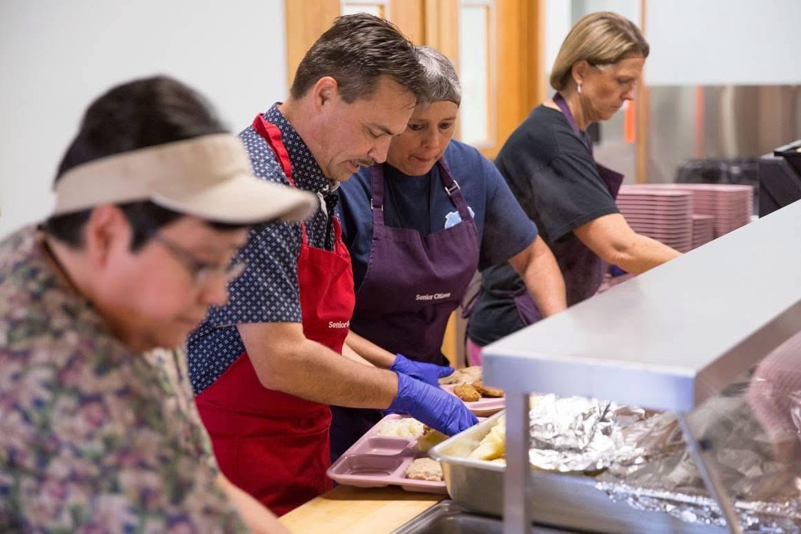 Chief Lambert serving lunch at Tsali Manor Senior Center