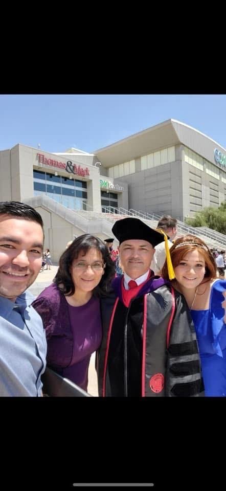 Nelson, Cyndi, Patrick, and Gina at UNLV commencement, Thomas and Mack Center, 2021